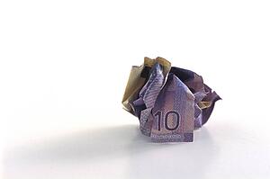 Crumpled ten dollar bill