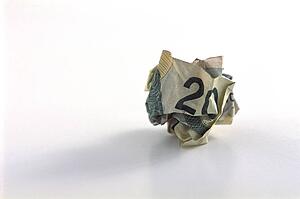 Crumpled twenty dollar bill