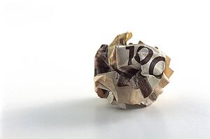Crumpled hundred dollar bill