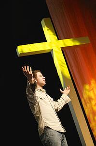 Man standing beside the cross
