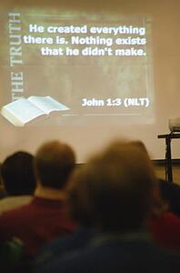 Scripture from John projected on wall in church