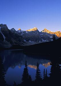 Sun setting mountain