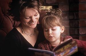 Mother reads with daughter