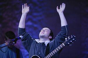 Man raising hands in worship