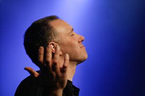 Worship leader raising hands