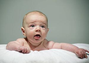 Curious baby lying on tummy