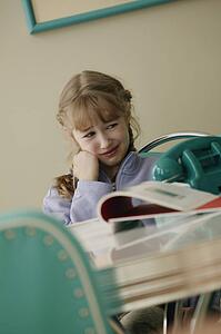 Girl thinking about doing homework