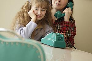 Child waits while mother on phone