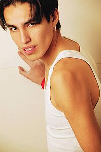 Teenager leaning on wall