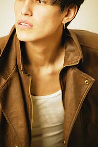 Serious teenager in brown leather jacket