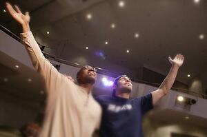 Two men worshipping God in unity