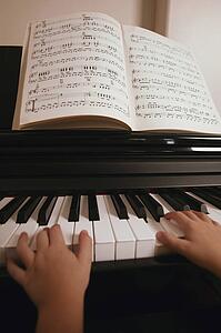 Child plays the piano
