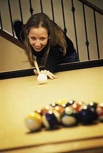 Woman playing pool
