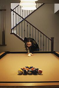 Woman playing pool game