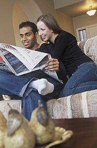 Couple reading the newspaper together