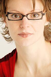 Portrait of woman with black framed glasses