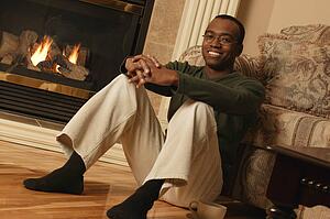 Happy in front of fireplace