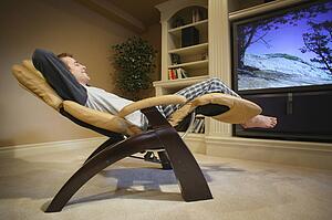 Man relaxes in front of television