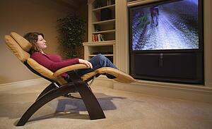 Woman relaxes in front of television