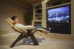 Man relaxes in front of television