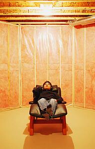 Man relaxes in unfinished room
