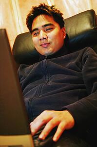 Man working on lap top computer