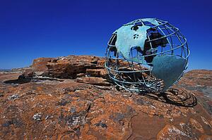 Globe on rock