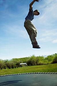 Jumping on a trampoline