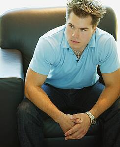 Man relaxes on a chair