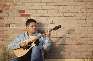 Man plays guitar