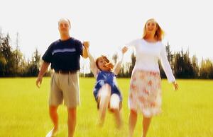 Parents play with child