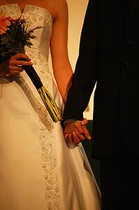 Bride and groom holding hands