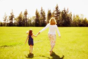 Mother and daughter running together