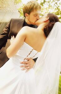 Married couple kiss