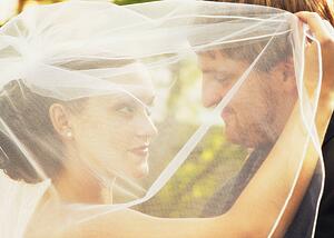 Married couple behind veil