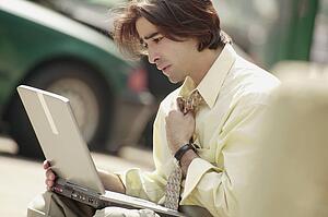 Man working on lap top computer