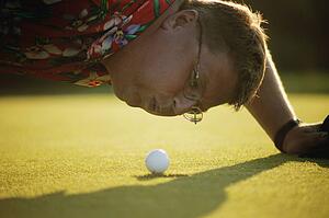 Blowing ball into the hole