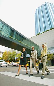 Businesspeople crossing the street