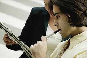 Studying a newspaper