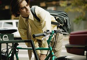 Businessman rides bike