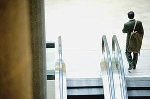 Businessman reaches the top