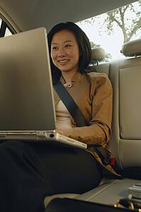 Woman works on lap top