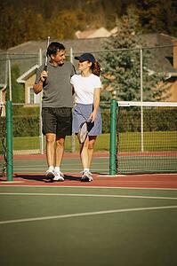 Couple in tennis courts