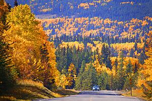 A car traveling through a scenic valley