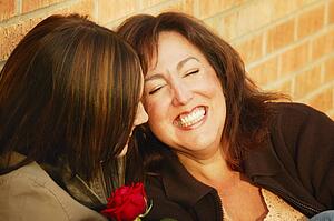 Two women laugh together