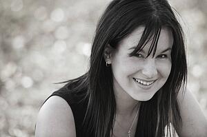 A woman smiles