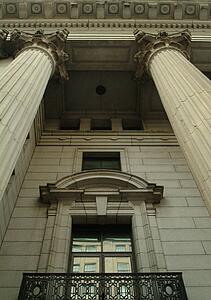 Pillars framing window of building