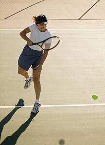 Woman plays tennis