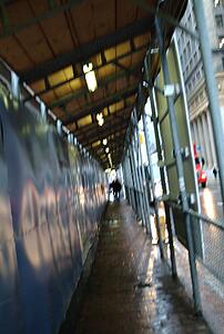 Walkway under scaffolding