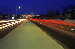Traffic driving down street